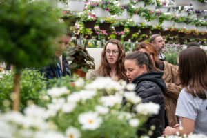People Looking At Flowers At Fogler's Greenhouse & Farm Market Open House 2019.